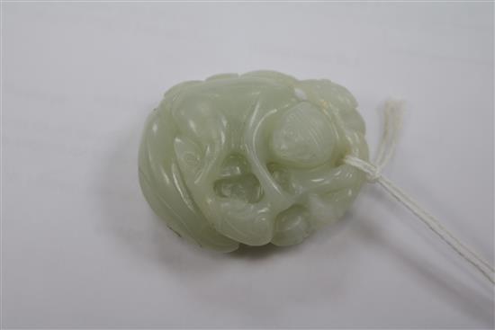 A Chinese pale celadon jade carving of a monkey and lingzhi fungus, 18th century 5cm